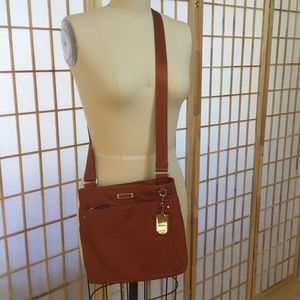 Tumi orange crossbody bag